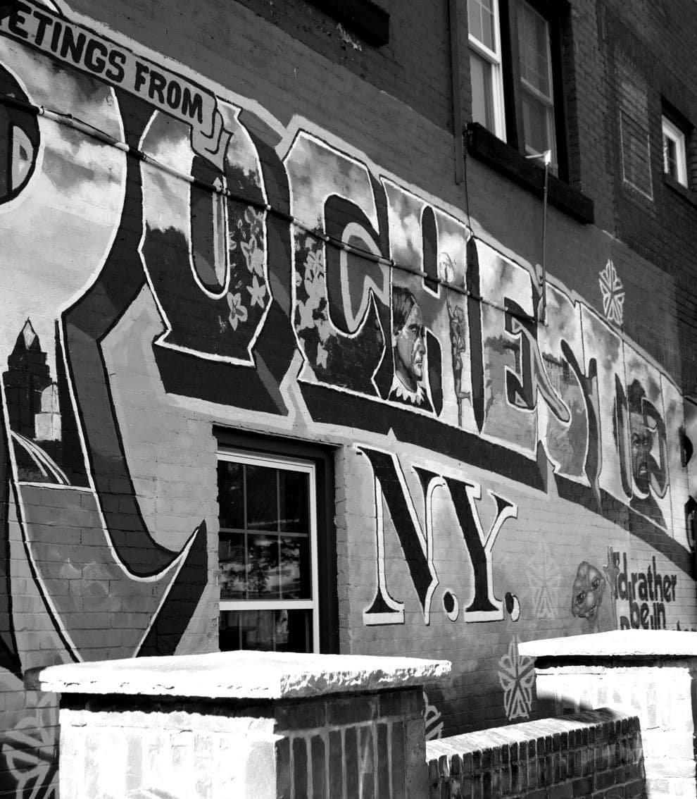 Photograph of a Rochester, NY mural on the side of a building.